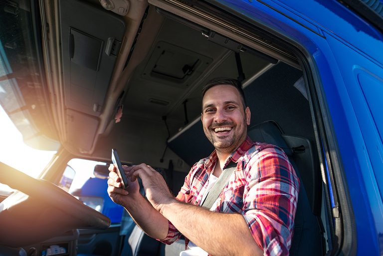 Driver smiling in his cab