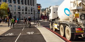 tanker lorry driving through London next to bike lanes