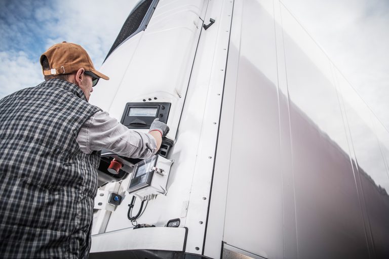 driver setting fridge temperature of refrigerated trailer
