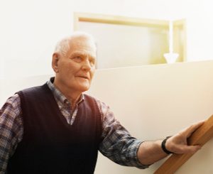 Senior man wearing a smart care watch