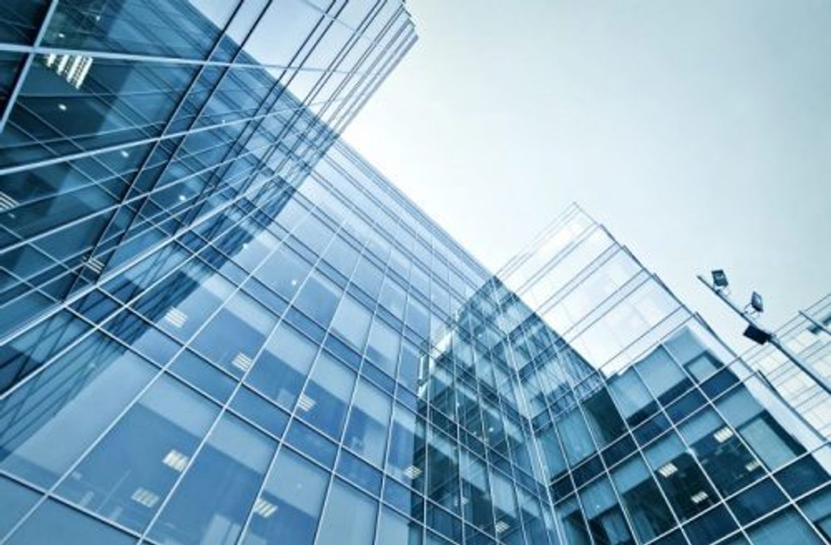 Looking up at a glass building