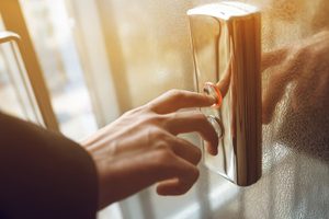 Pressing an elevator button