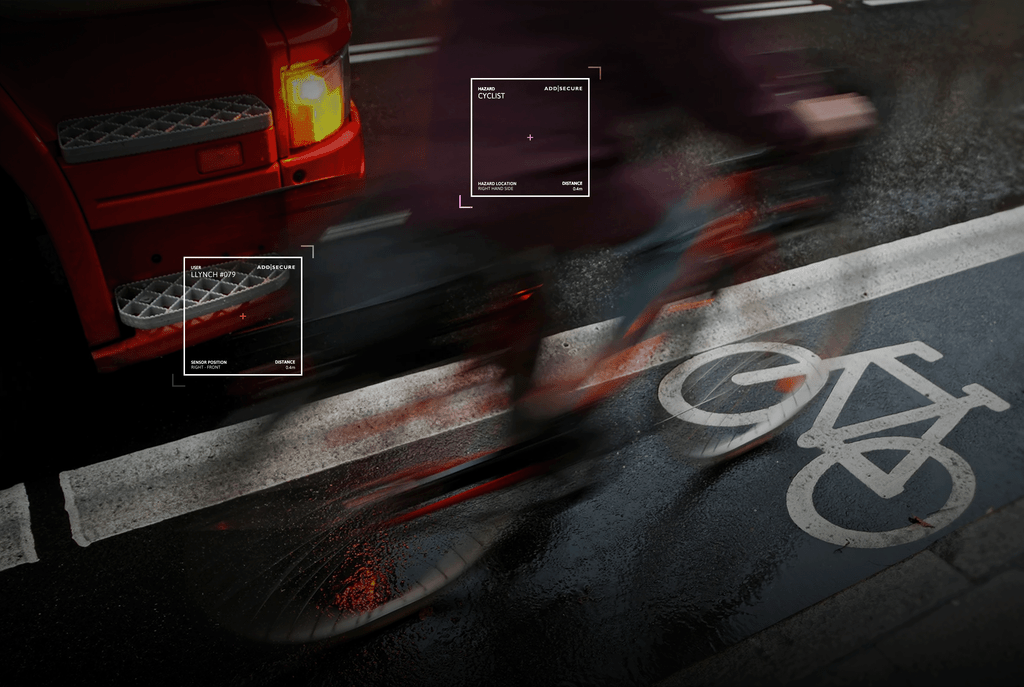 cyclist riding next to a hgv